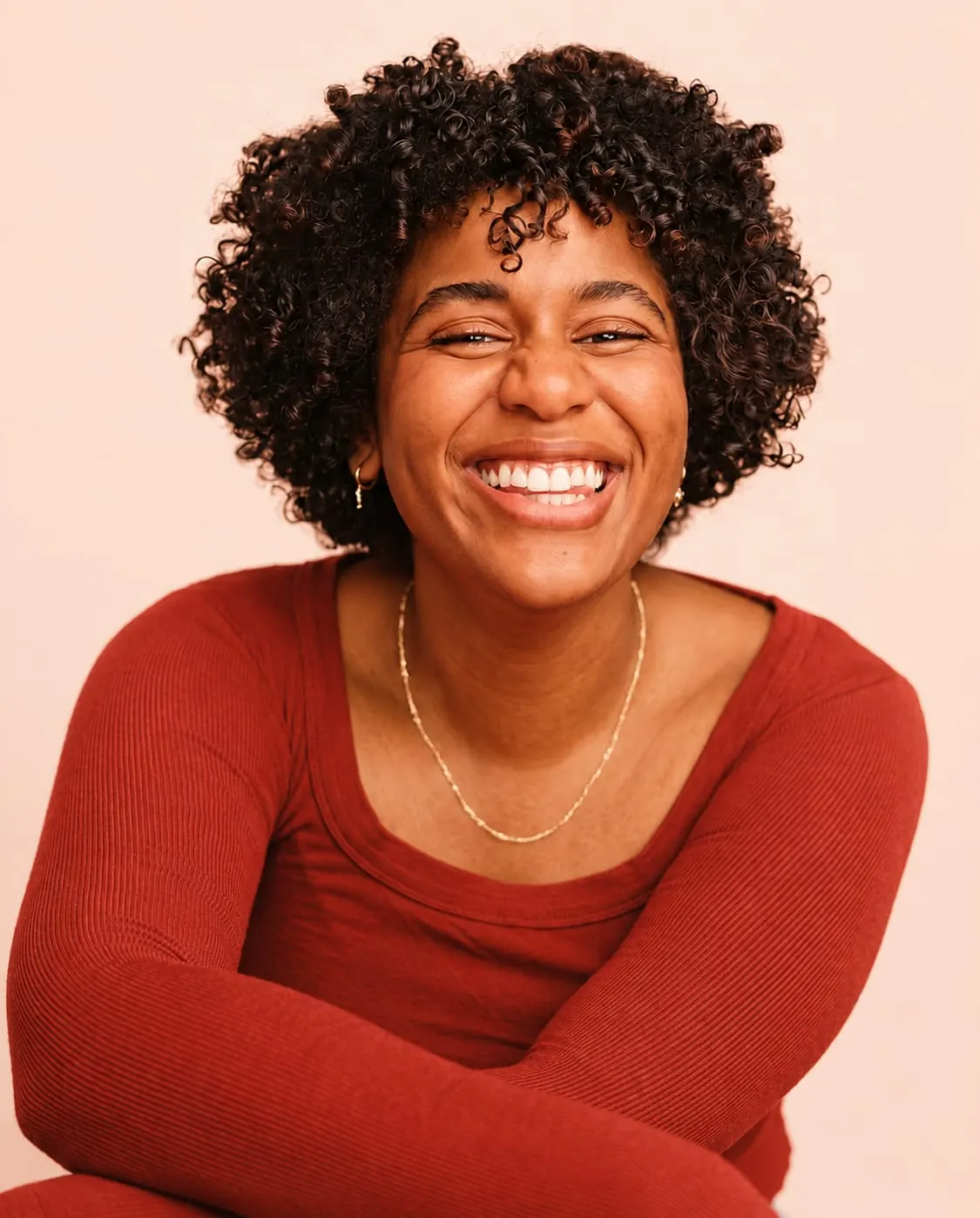 A woman smiling mid-conversation, the kind of moment we make sure no one is left outside of.